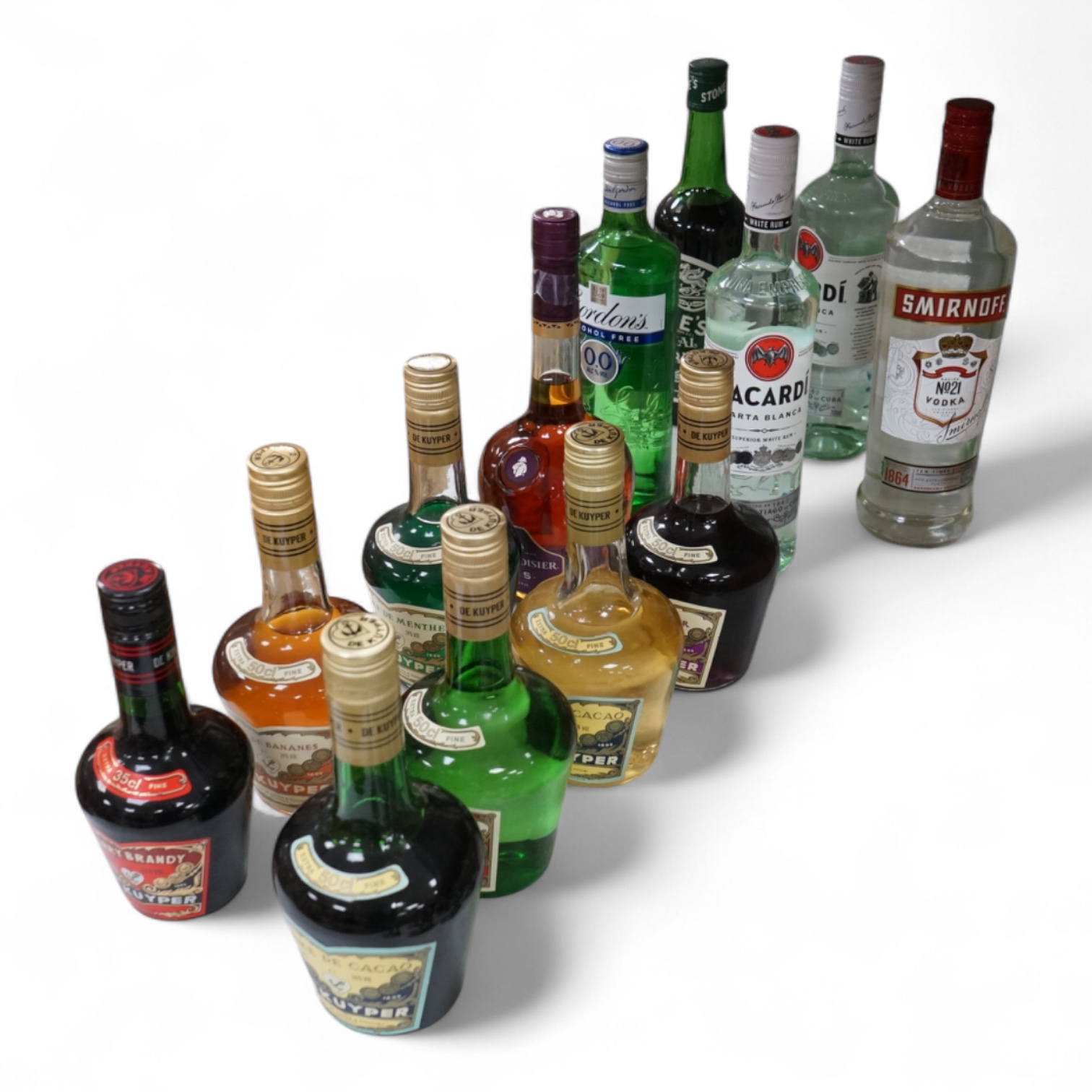 Thirteen bottles of spirits to include Bacardi, cherry brandy and Crème de Menthe
